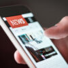Mobile,News,Application,In,Smartphone.,Man,Reading,Online,News,On